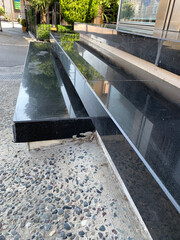 Steps, stairs, modern black stone steps outside building, staircase is finished with glossy tiles and contrasting light inserts