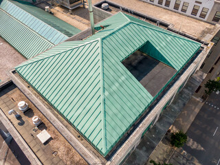 Sunny Daytime Drone Images of Large Standing Seam Metal Roof on a Large Commercial Building in Downtown Raleigh NC