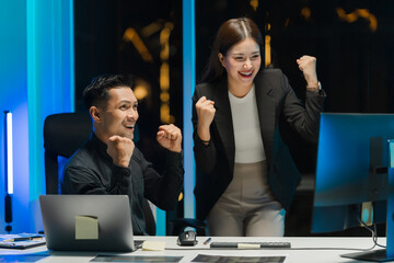 Successful Business Team Celebrating at Night © Kritdanai
