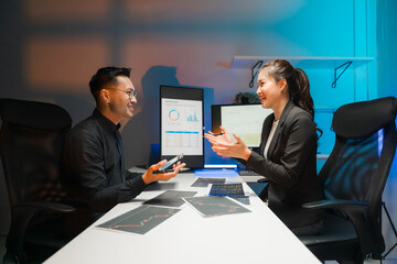 Business Professionals Discussing Data in Modern Office