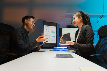 Business Professionals Discussing Data Charts in Office