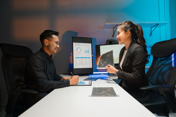 Business Professionals Discussing Data Charts in Office