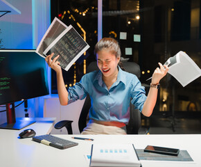 Stressed Woman Working Late with Documents