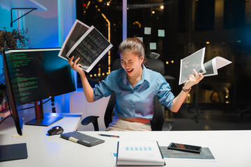 Frustrated Woman with Coding Documents at Desk