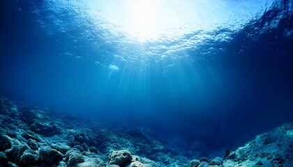 Obraz premium underwater ocean blue abyss with sunlight diving and scuba background