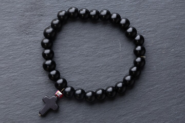 black beads on black background