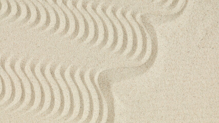 White clean sand with wave pattern as background.