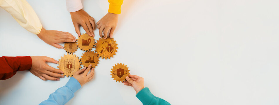 Fototapeta An engaging scene showing diverse hands collaboratively holding gears that represent various cybersecurity concepts, symbolizing teamwork and innovation in digital protection strategies. Amity