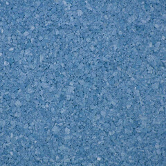Blue granulated texture with small crystalline particles, ideal for backgrounds, abstract designs, packaging, craft projects, decorative surfaces, and digital artwork overlays.