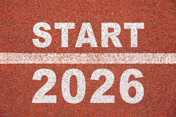New year 2026 written on the road in the middle of athletics track as a start. Concept of planning