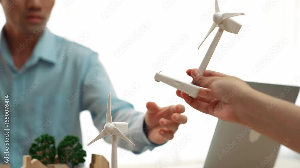 Poster windmill model represented using clean energy and wooden block symbolized ecology house. green energ