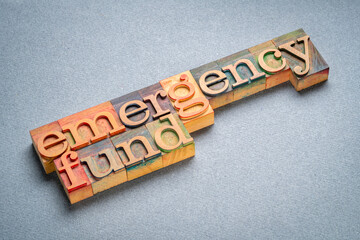 emergency fund, word in vintage letterpress wood type, financial concept