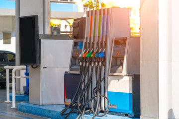 Petrol fuel row pistols nozzle refill at gas station. Fuel price crisis impact fuel cost in transport business and Travel energy consumption rise in petroleum gasoline station service production