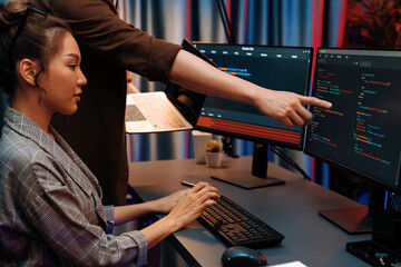 Serious of IT developers discussing intelligent website development coder system running data...
