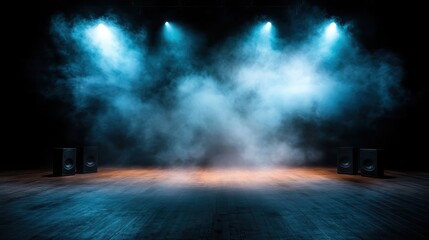 A dramatic stage set with blue lighting and smoke, creating an atmospheric backdrop suggesting anticipation and excitement for a performance or event.