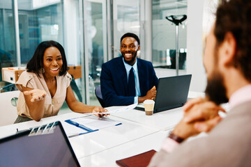 Business team discussing a project during a meeting in a modern office