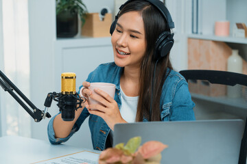 Host channel Asian influencer talking in broadcast streaming online wearing headsets on social...