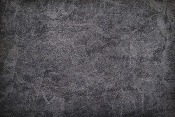Texture of black polished concrete background. Dark plaster wallpaper with rough cement texture....
