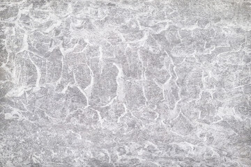 Texture of gray polished concrete background. Light plaster wallpaper with rough cement texture. Empty grunge wall concept or floor backdrop. Abstract surface mockup. Top view, close up, copy space