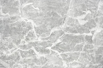Naklejka premium Texture of gray polished concrete background. Light plaster wallpaper with rough cement texture. Empty grunge wall concept or floor backdrop. Abstract surface mockup. Top view, close up, copy space