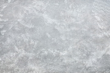 Texture of gray polished concrete background. Light plaster wallpaper with rough cement texture. Empty grunge wall concept or floor backdrop. Abstract surface mockup. Top view, close up, copy space