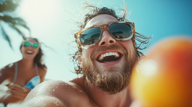 A cheerful man capturing a selfie with a smiling woman at the beach, showcasing the joy of summer fun and carefree moments in a sun-soaked paradise.