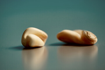 Smooth Sea Pebbles on a Turquoise Surface.
