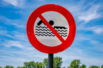 Red sign, forbidden to swim in Beringen, Limburg, Belgium