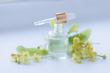 linden extract in a small glass bottle. Selective focus.