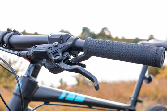 Close-Up of Bicycle Brake Lever on Handlebar - Powered by Adobe