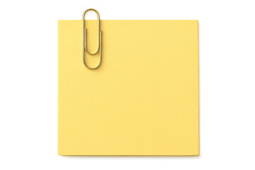 Yellow sticky note with golden paperclip fastened, resting on transparent surface, offering blank writing area for custom messaging