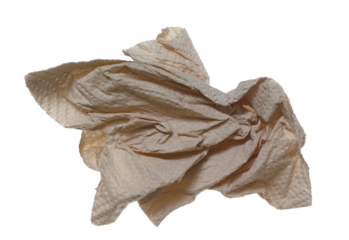 Natural brown paper kitchen towels flying, disposable, non-toxic and no dyes, crumpled and wrinkled ball isolated on white background	