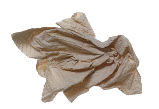 Natural brown paper kitchen towels flying, disposable, non-toxic and no dyes, crumpled and wrinkled ball isolated on white background	