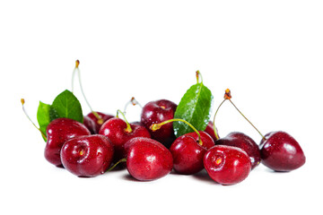 Ripe juicy cherry with  leaves isolated on white background.