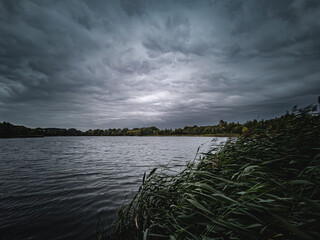 Dark clouds over a lake