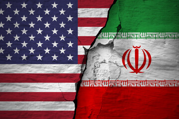 Conflict between the countries. America and Iran flags on the cracked concrete wall.  The deterioration of diplomatic relations. Confliction and crisis concept .