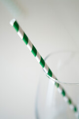 a straw in a glass cup