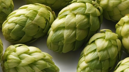 Fototapeta premium Close-up of fresh green hops, showcasing their vibrant color and intricate textures, Ideal for use in brewing, culinary arts, or botanical presentations, Perfect for advertising products or recipes,