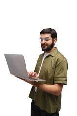 Man works on a silver laptop, concentrating in the white studio, a picture of work and technology meeting