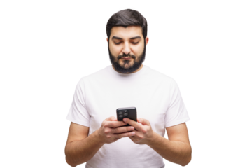 Modern communication now grips young man's attention as he focuses intently upon smartphone while standing against bright white backdrop