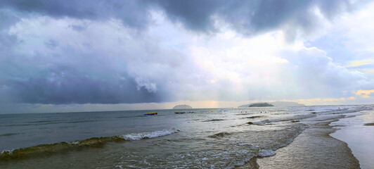 Tanjung Aru View from Serene Sandy Shore Under Overcast Skies