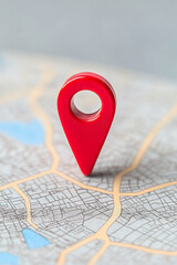 Naklejka na ściany i meble Red pin on map, location marker, navigation tool. Symbol of place, destination, and point of interest. Close up for focus.