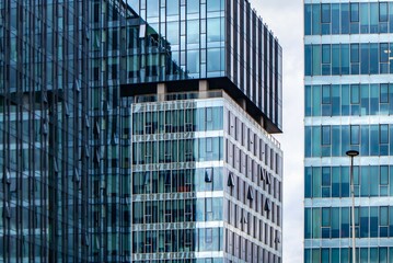 Modern glass office buildings in business district. Contemporary architecture with reflections and geometric patterns