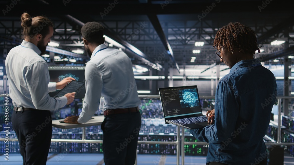 Poster data center system administrators collaborating to maintain servers using artificial intelligence. t
