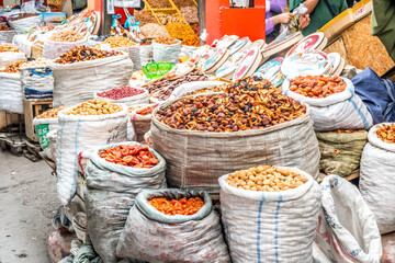 Close up view of bags of colorful different food grains in Osh bazaar in Bishkek, capital of Kyrgyzstan.