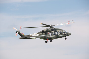 flying military transport helicopter in the sky