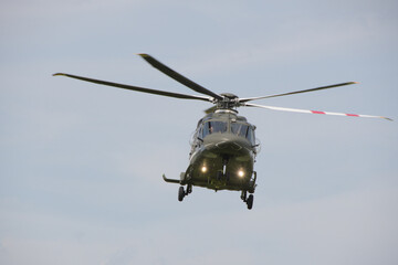 flying military transport helicopter in the sky