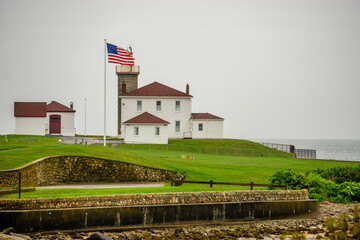 Watch Hill Light in Rhode Island Surrounded by a Stone Seawall