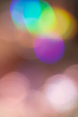 Abstract blurred lights in vibrant colors, creating bokeh effect. Mix of red, green, purple and...