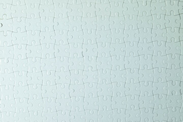 Top view Seamless texture of white jigsaw puzzle pieces fully connected idea for...